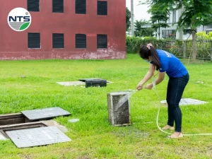 Image of NTS team cleaning wastewater treatment system